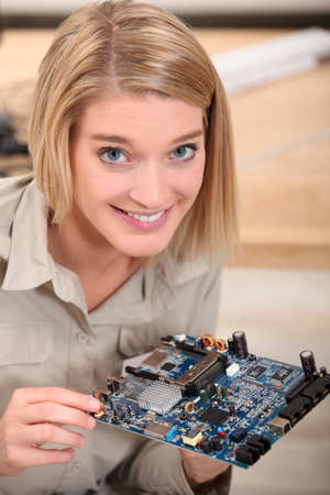 woman repairing an electronic componentの写真素材