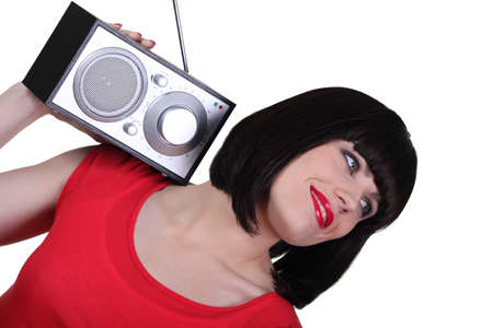 Portrait of a woman with radioの写真素材