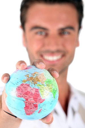 Man holding globeの写真素材