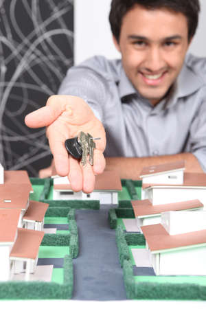 Young man with the keys to a new houseの写真素材