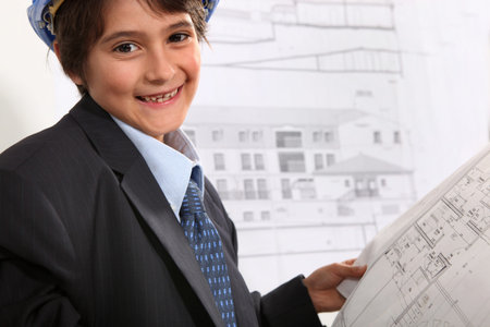 Child with costume and plans