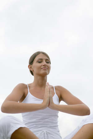 Woman meditating outdoorsの写真素材