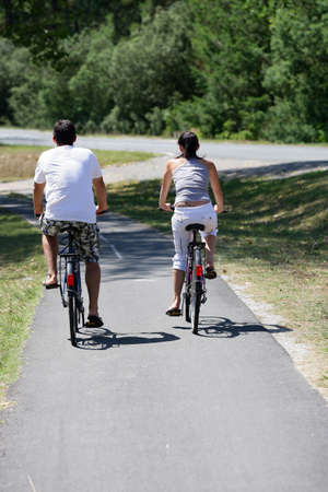 Man and woman having a bike rideの写真素材
