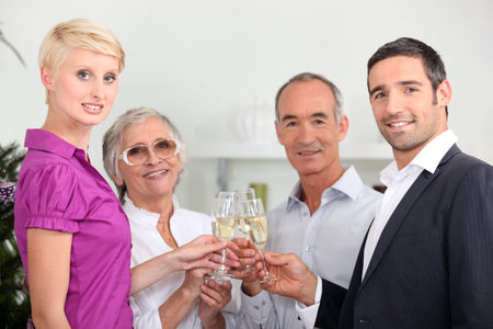 Two couples toasting with champagne