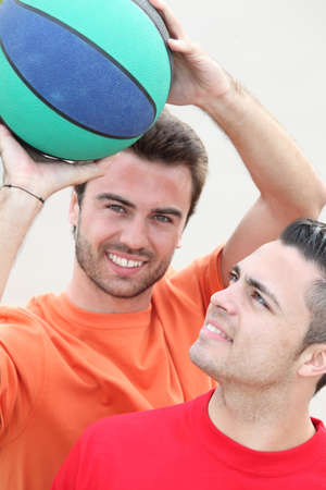 Boys playing basketballの写真素材