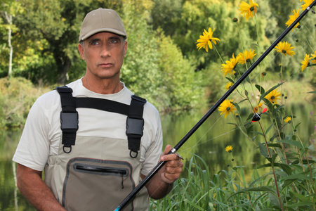 Fisherman on the edge of river