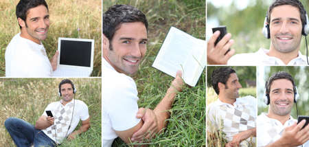 Man listening to music outdoors via laptopの写真素材