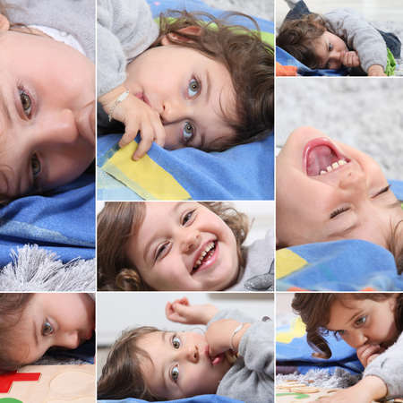 Mosaic of toddler laying on favorite towelの写真素材