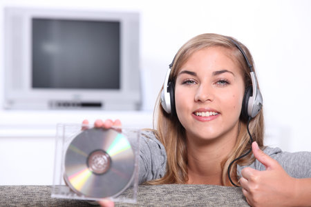 Young woman holding a CD