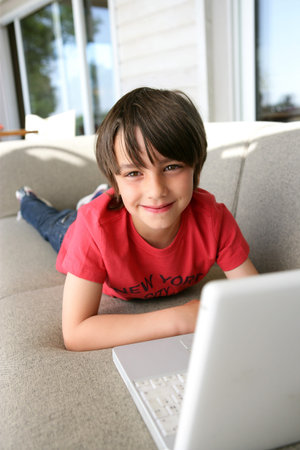 Young boy using a laptop