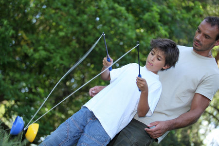Son playing with diabolo