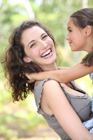 Mother and daughter in her arms