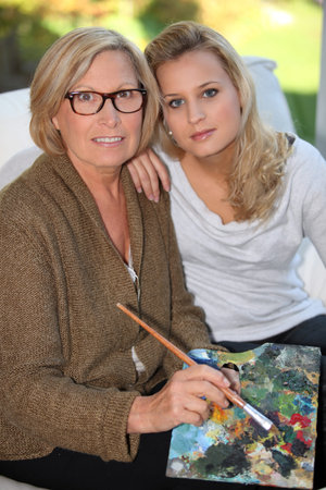 Grandmother and granddaughter painting