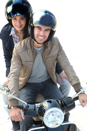 riding a scooter together