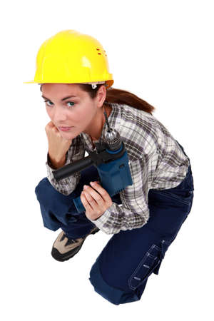 craftswoman holding a drillの写真素材