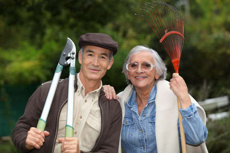 couple of pensioners gardeningの写真素材