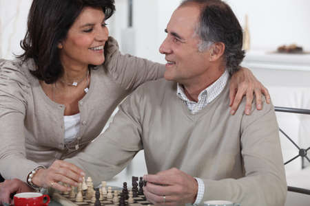 Couple playing chessの写真素材