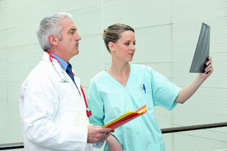 Doctor and nurse with image