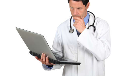 Doctor looking at laptopの写真素材