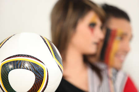 German supporters with soccer ballの写真素材