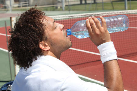 tennis player drinking waterの写真素材