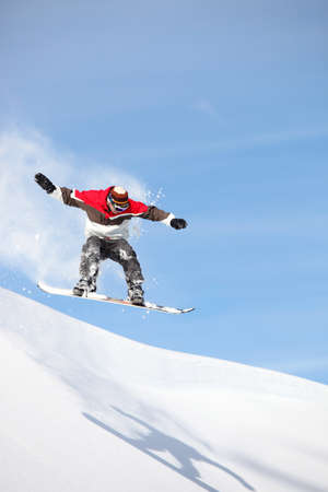 Snowboarder performing impressive jumpの写真素材