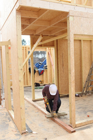 Builder working on a wooden structure