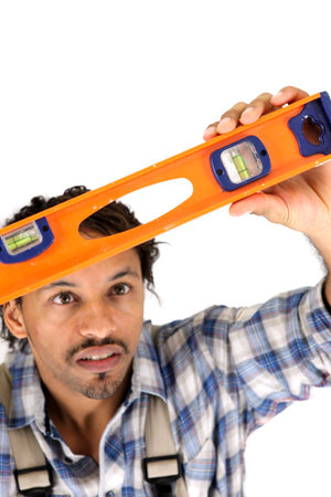 Worker carefully watching his level spirit