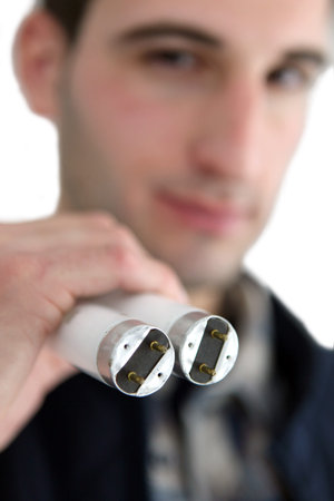 electrician replacing tube lighting