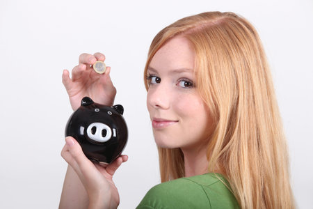portrait of a young woman with money box