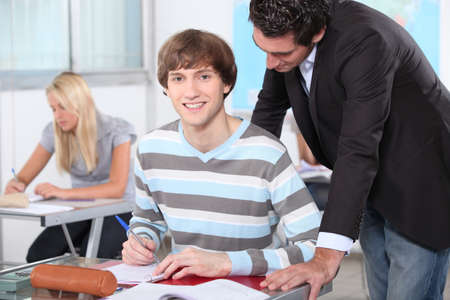 teacher helping a studentの写真素材