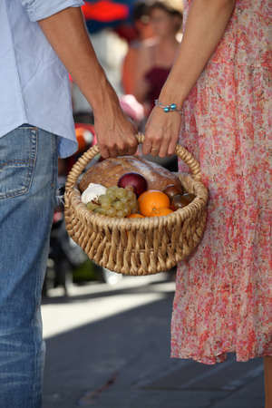 Couple shopping at local marketの写真素材