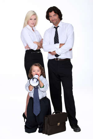 Businessman and his smart familyの写真素材