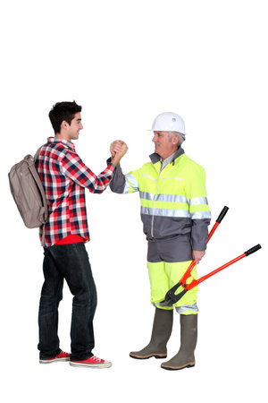 Experienced tradesman meeting his new apprentice