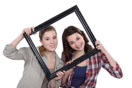 Teen behind black frameの写真素材