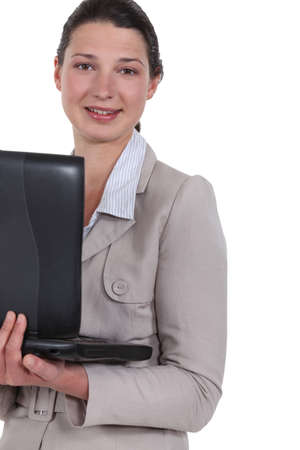 Woman carrying her laptopの写真素材