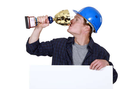 Builder with a trophyの写真素材