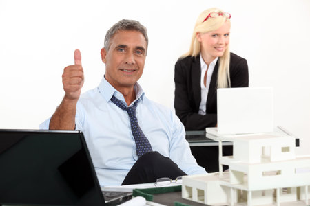 Estate agent with thumbs up