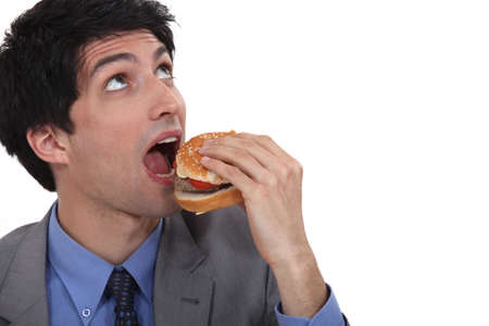 Man about to eat a burgerの写真素材