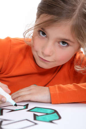 Girl colouring recycling signの写真素材