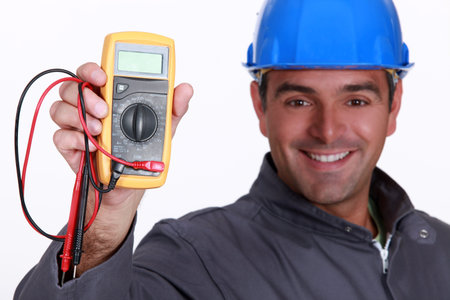 Electrician holding voltmeter