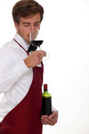 sommelier tasting the wineの写真素材