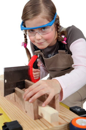 schoolgirl dressed as joinerの写真素材