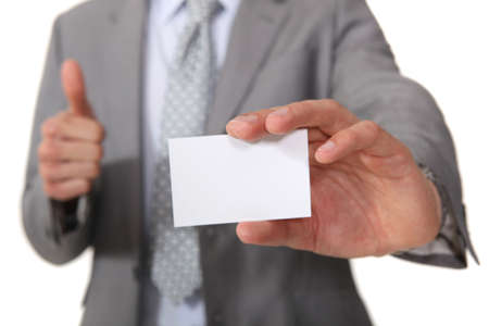 Executive with a blank businesscardの写真素材