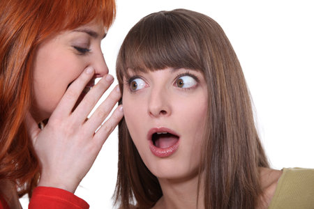 Two women gossiping