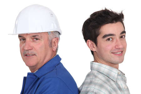 portrait of junior craftsman and mature instructorの写真素材