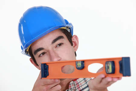 young carpenter using rulerの写真素材