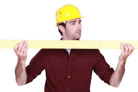 Workman holding a plank