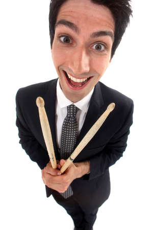 Businessman holding drum sticksの写真素材