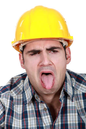 Construction worker with his tongue outの写真素材